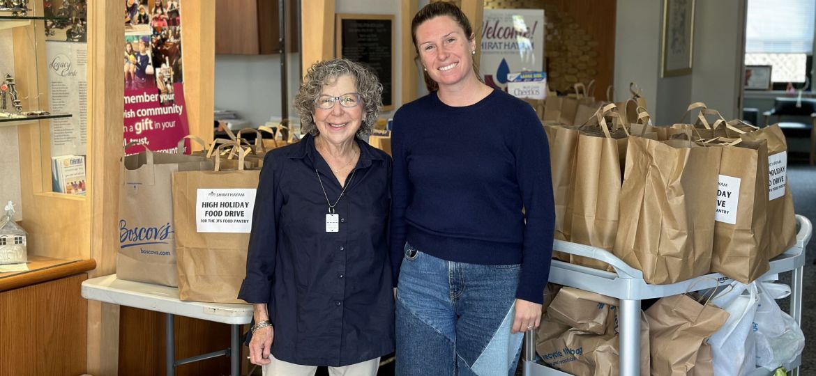 Sheila Friedman and Julia Tracy surrounded by High Holiday Food Bags for Jewish Family Service of Atlantic & Cape May Counties