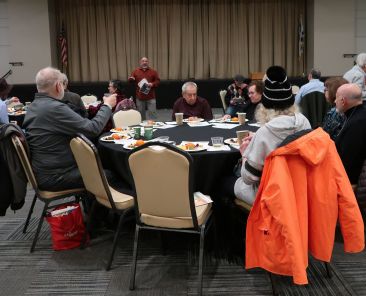 Josh Culter of the Board of Jewish Education leads the Tu BShevat Sedar Lunch on February 13, 2025.